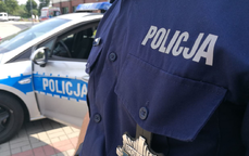 Na zdjęciu napis policja w tle radiowóz